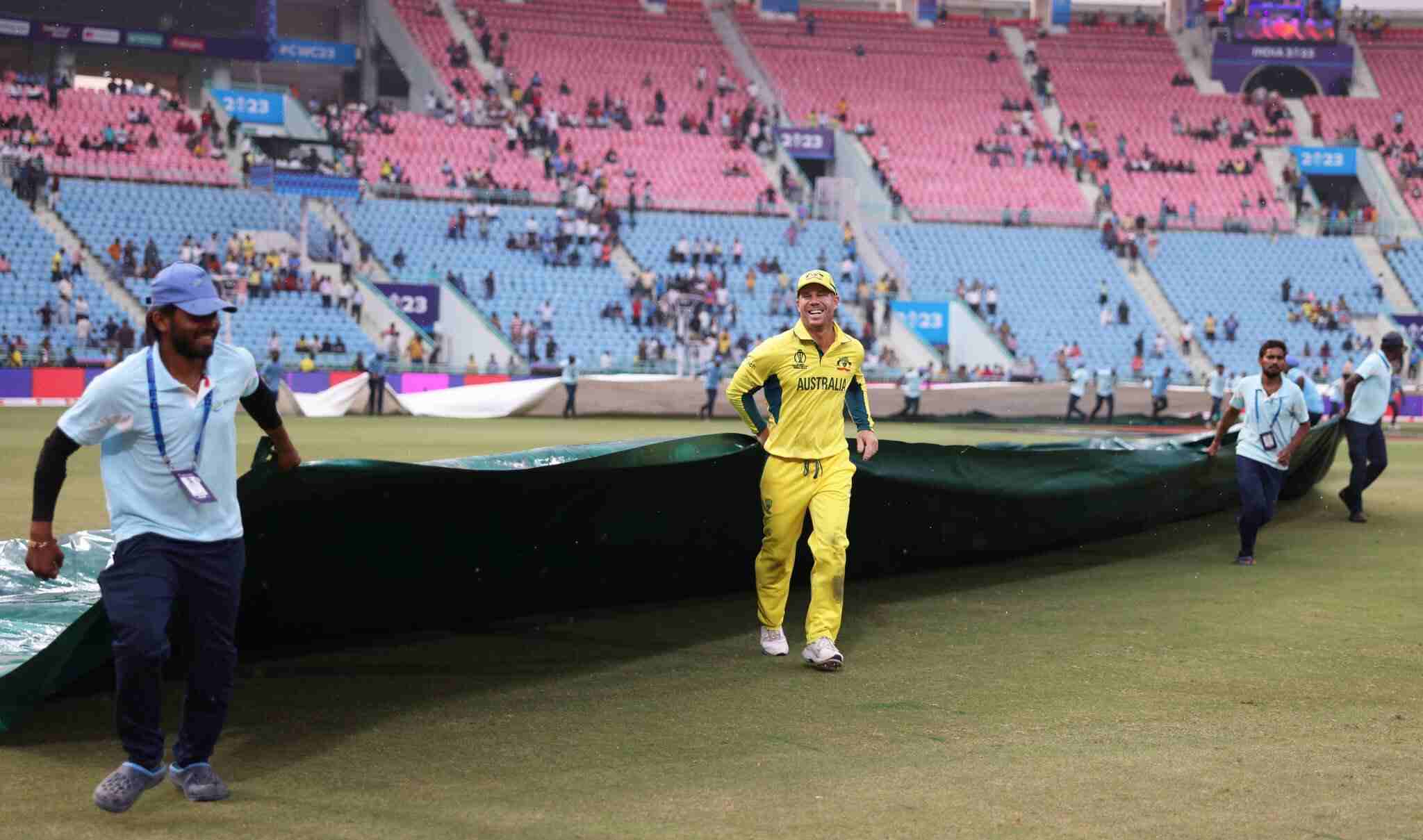 David Warner Assists Ground Staff in Covering The Ground During Rain Delay [See Pics]