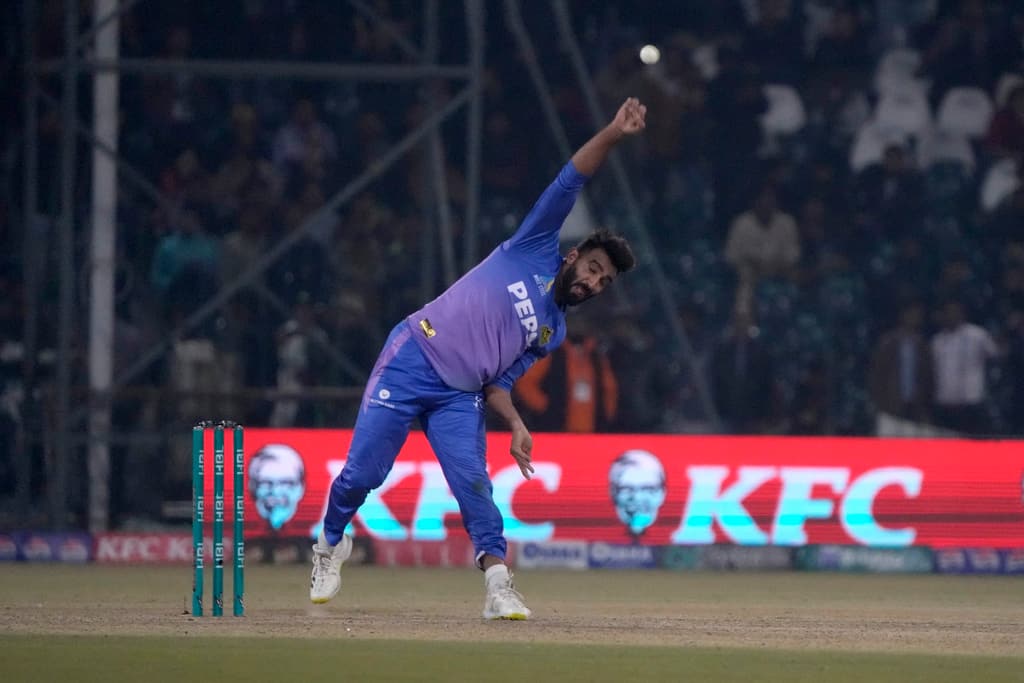 Usama Mir dishing a ball against Malik (AP Photo)