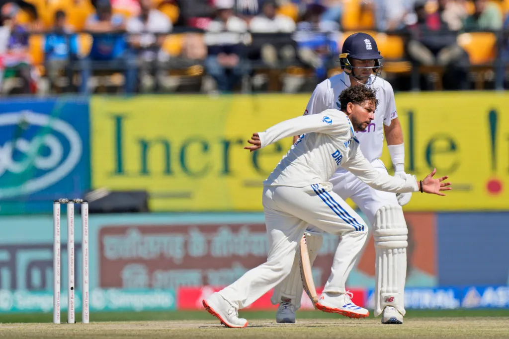 Kuldeep Yadav saving the ball off his own bowling (AP Photo)