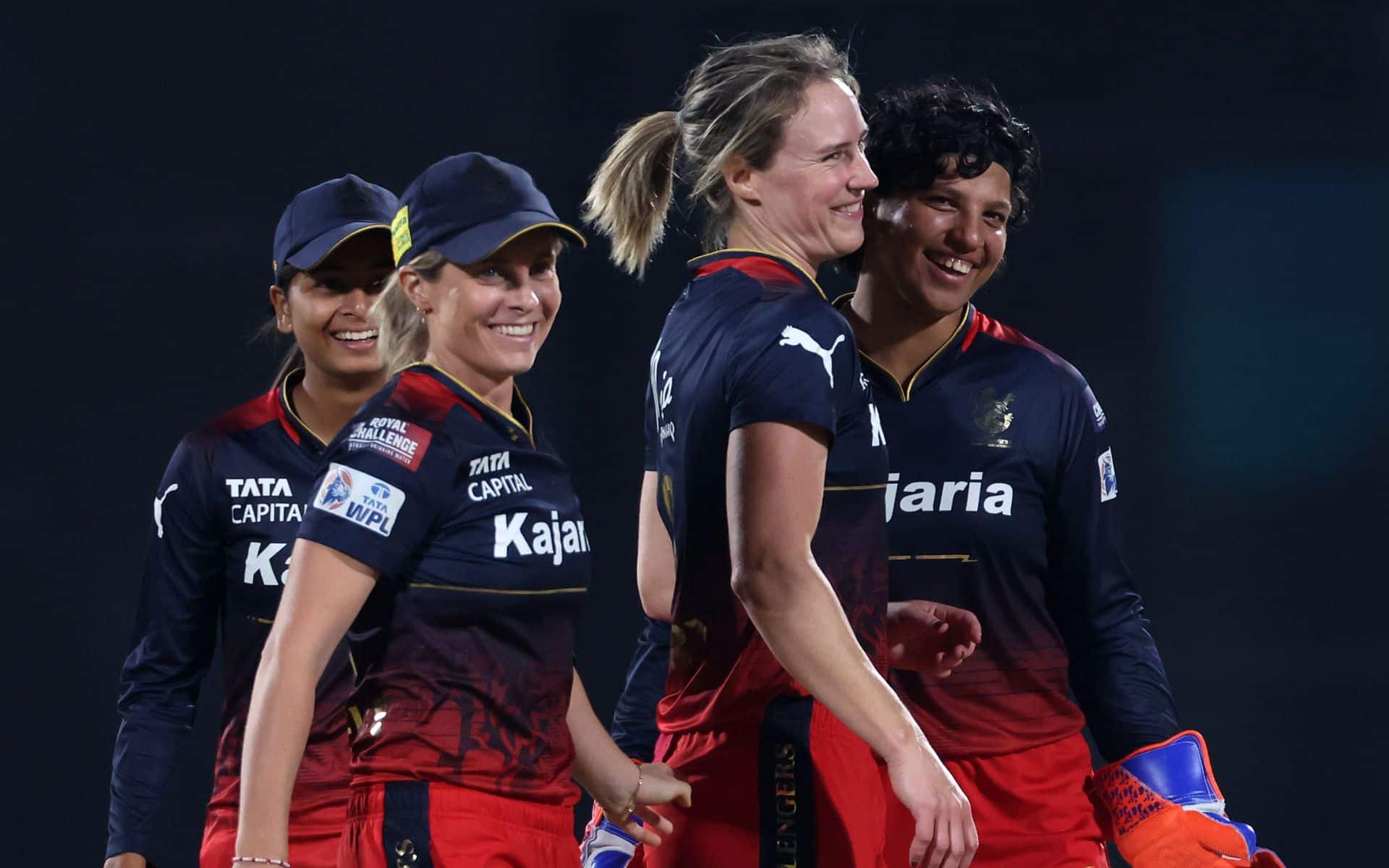 Ellyse Perry celebrating a wicket with RCB teammates (X.com)