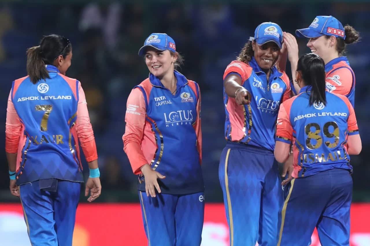 Mumbai Indians players rejoicing after a wicket (BCCI)