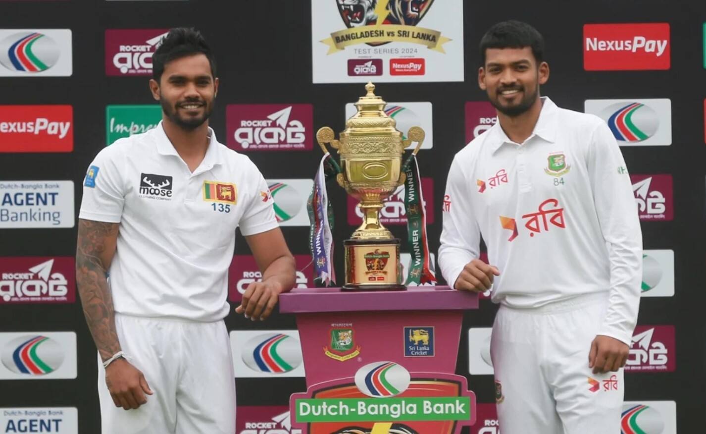 Captains Dhananjaya de Silva and Najmul Hossain Shanto pose with the trophy (BCB)