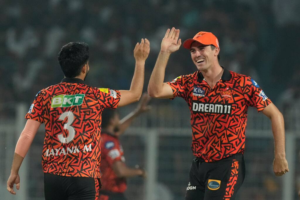 Pat Cummins and Mayank Markande celebrating a wicket (AP)