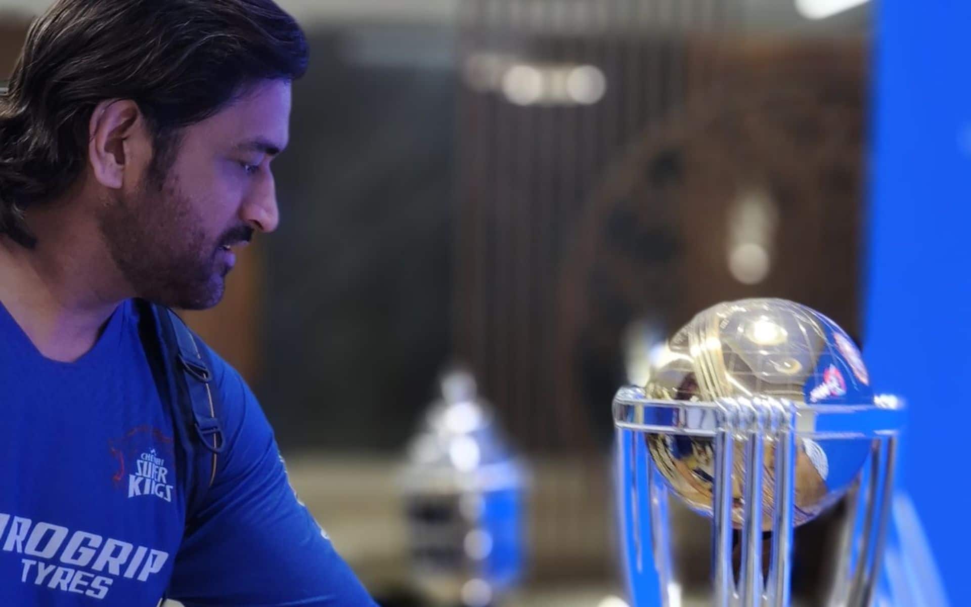 MS Dhoni looking at WC 2011 trophy at BCCI HQ in Mumbai (x.com)