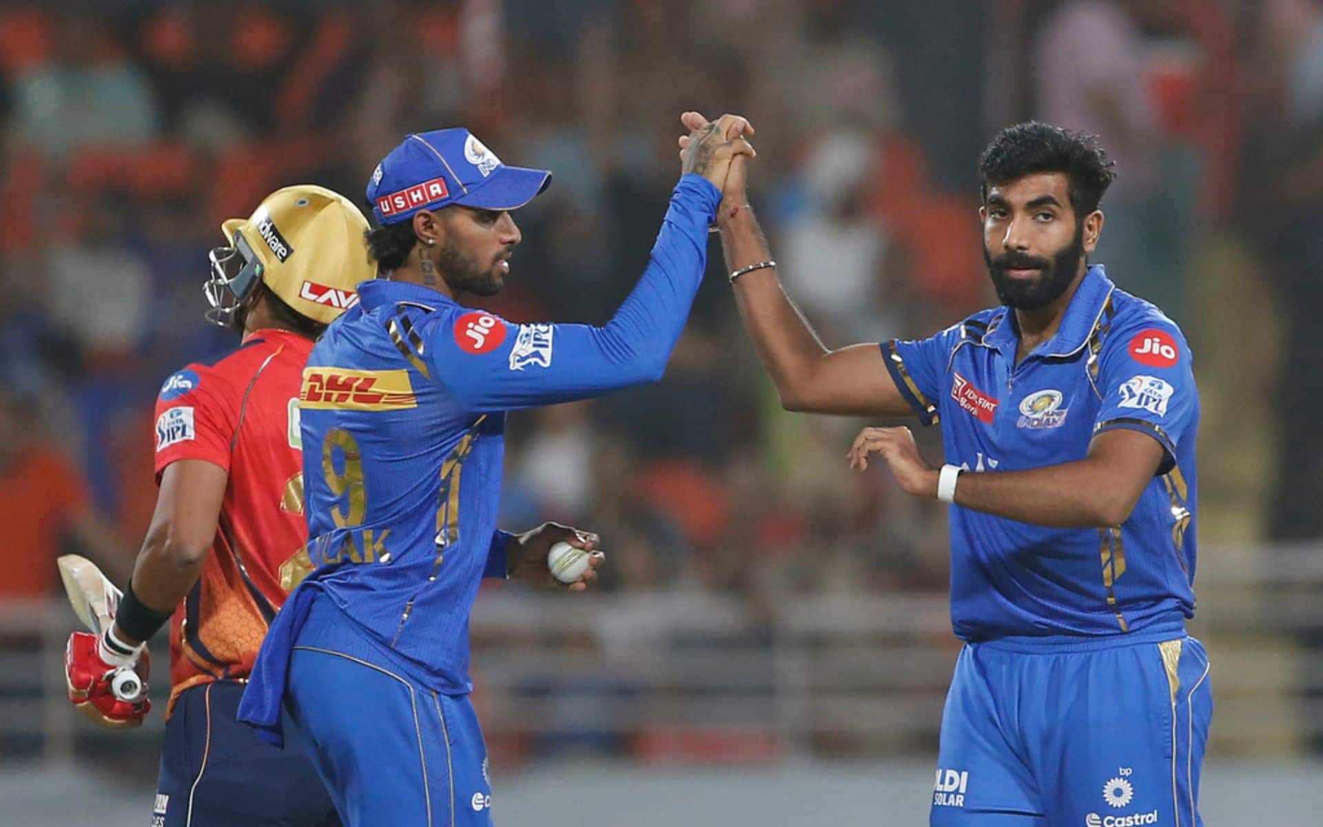 Bumrah celebrating a PBKS wicket with Tilak Varma (AP)