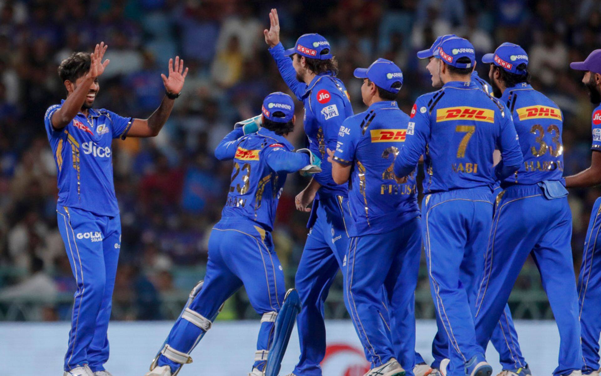 MI players celebrating after a wicket (AP Photo)