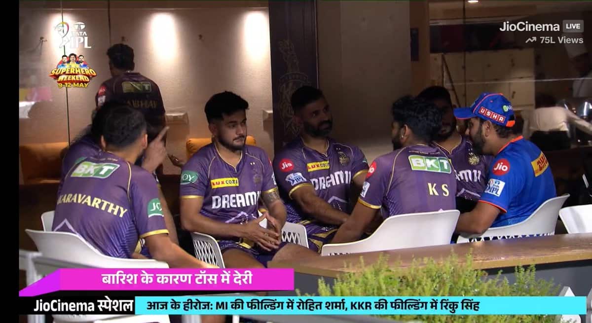 Rohit Sharma sitting alongside KKR players and staff