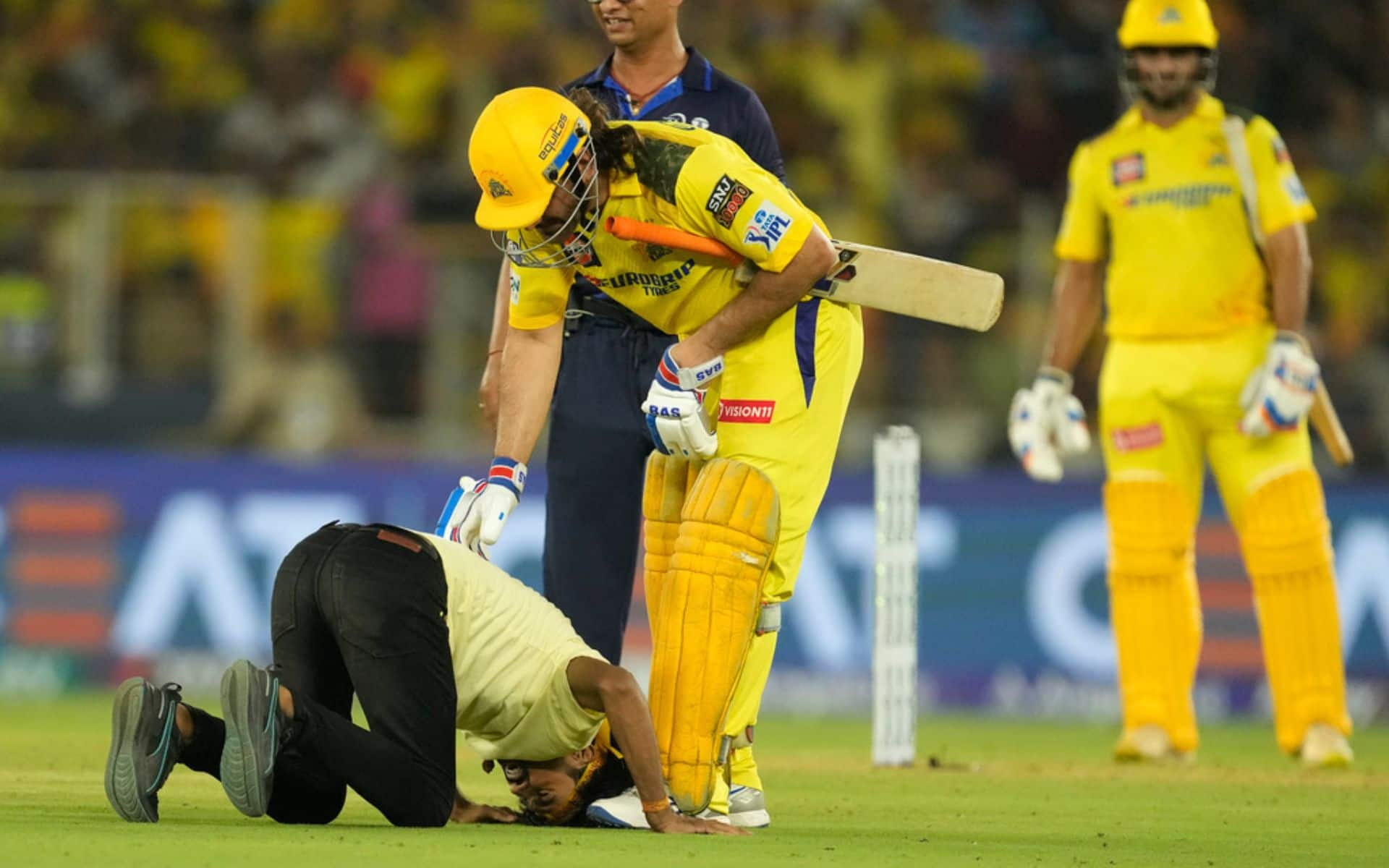 A fan touching MS Dhoni's feet (AP)