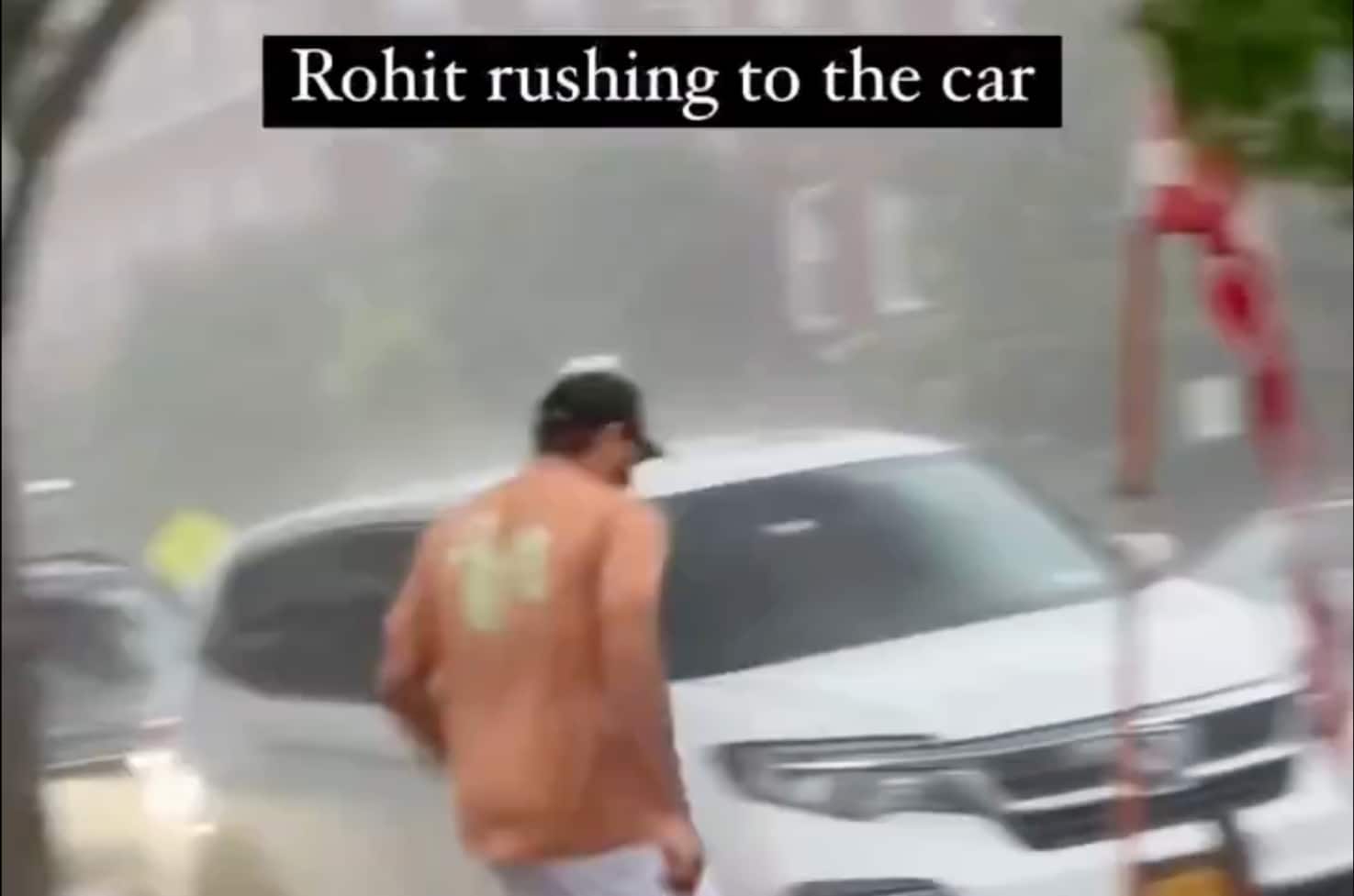 Rohit Sharma running to avoid rain [X]