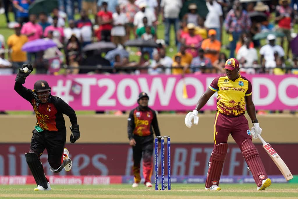 The happiness was beyond comparable on the faces of PNG players after Powell's wicket (AP Photo)