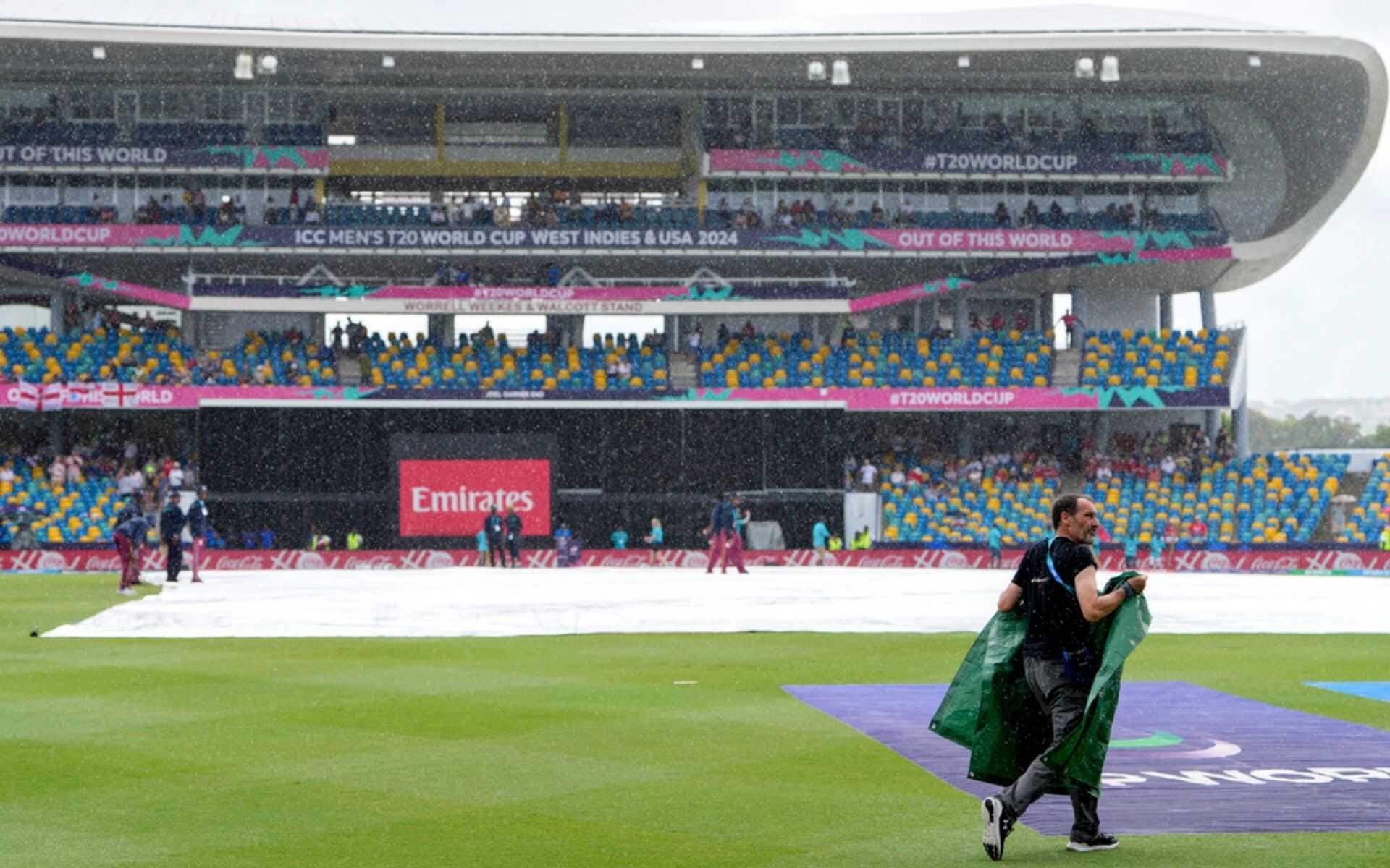Groundsmen at work as rain stops play in ENG vs SCO after 6.2 overs (AP)