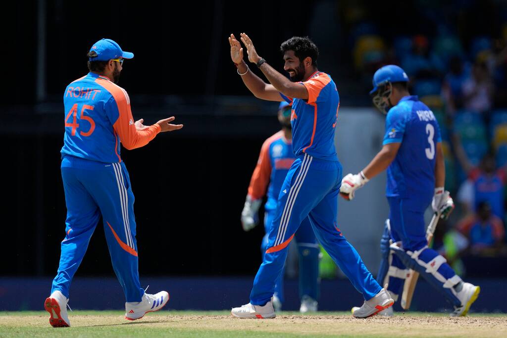 Bumrah celebrates with Rohit Sharma after wicket vs AFG (AP Photo)