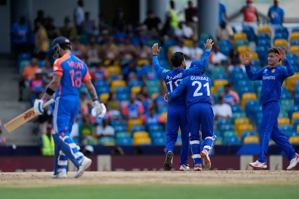 Virat Kohli walking off after getting dismissed Vs AFG [AP]
