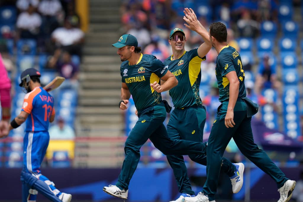 The Australian team celebrating Virat Kohli's wicket (AP)