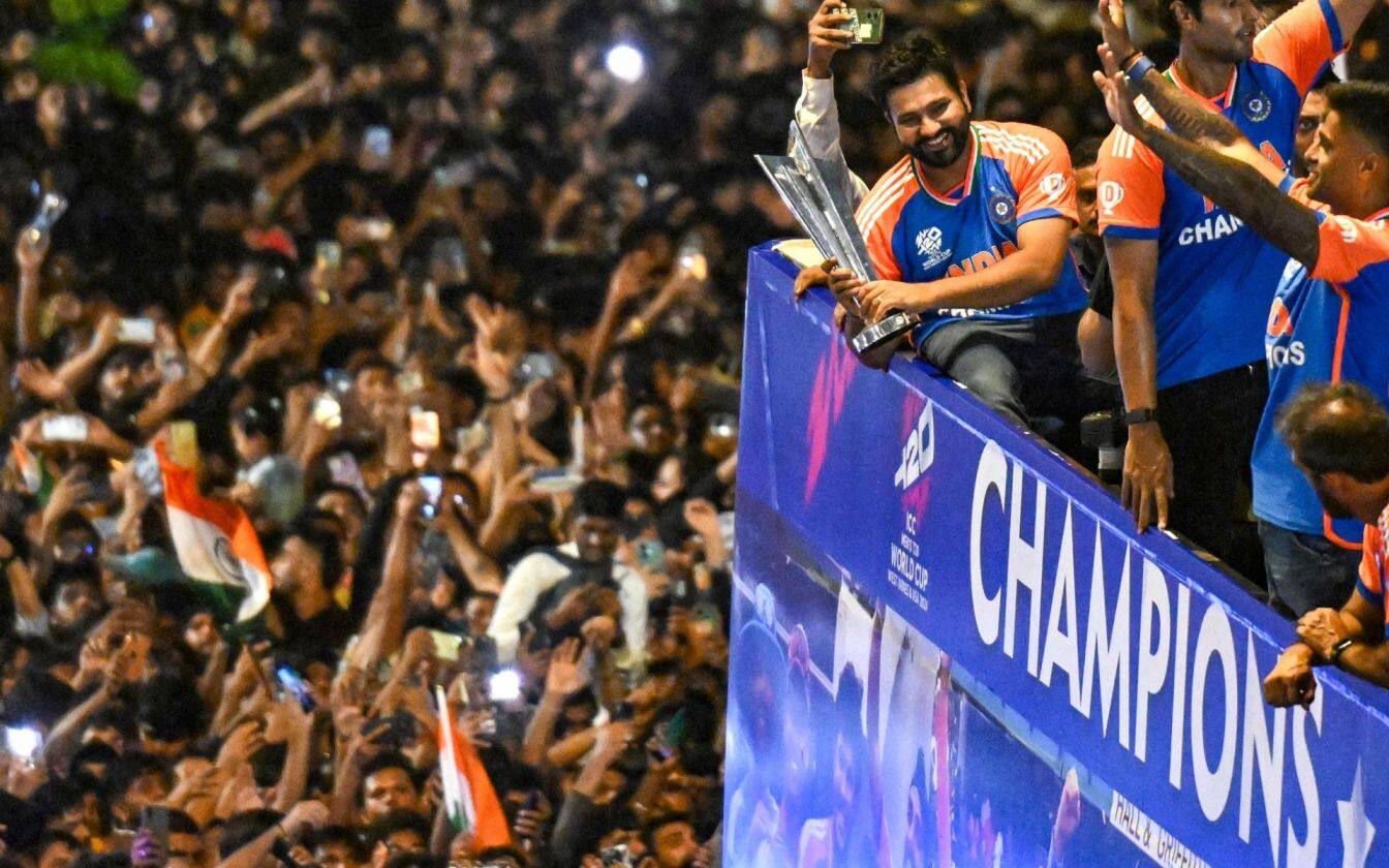 Rohit Sharma with WC trophy doing victory parade in Mumbai (X.com)