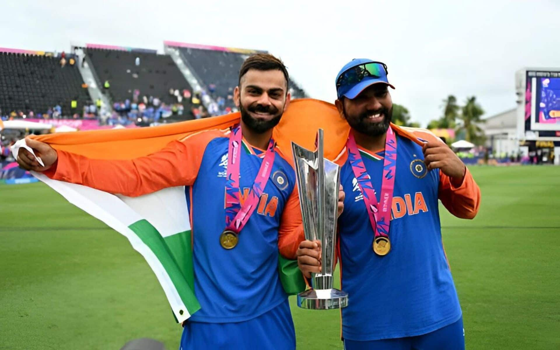 Virat Kohli & Rohit Sharma holding the T20 WC 2024 trophy 