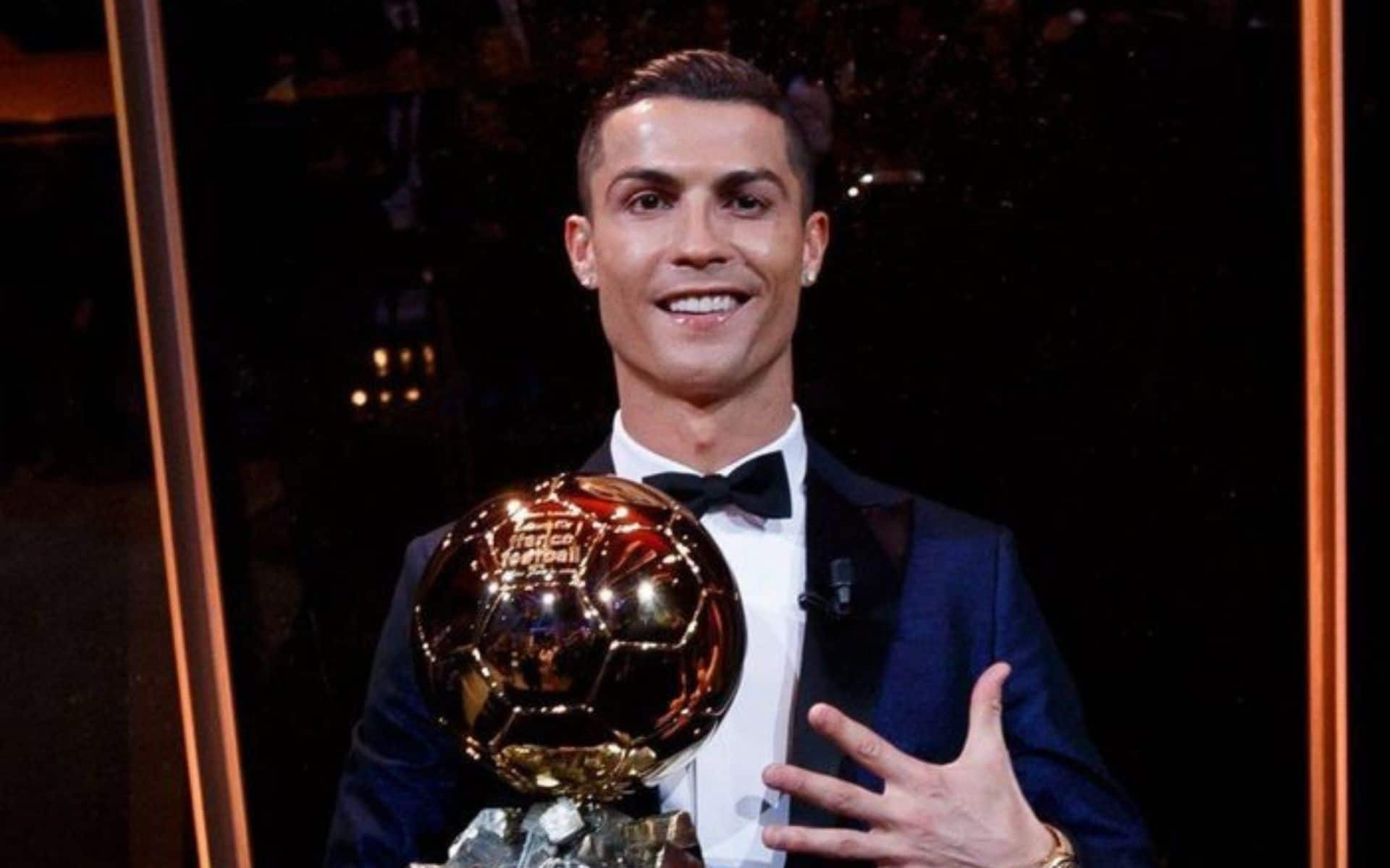 Cristiano Ronaldo with the Ballon d'Or award [X]