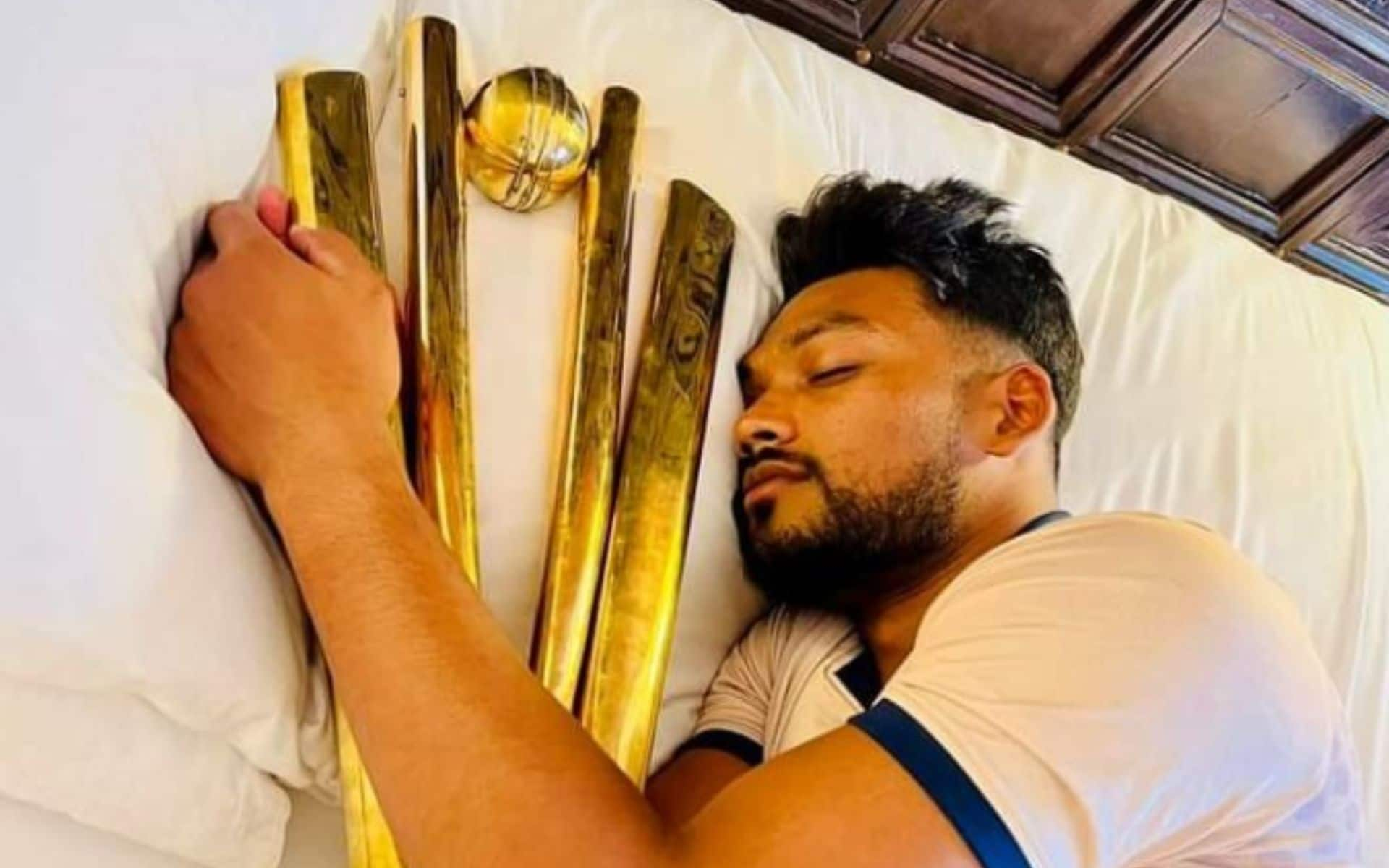 Najmul Shanto shared a photo of himself sleeping with the trophy (X)