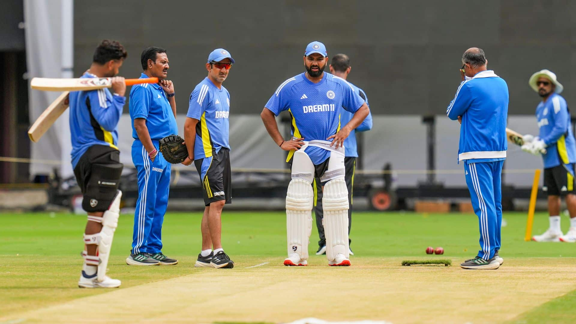 Rohit Sharma having a close look at Bengaluru's pitch for 1st Test [Source: PTI]