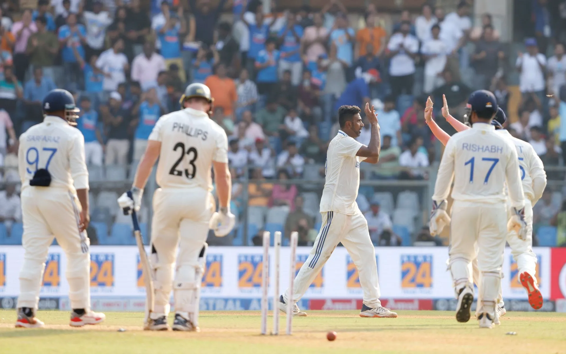 Indian players celebrating a NZ wicket on Day 2 [Source: @BCCI/x]