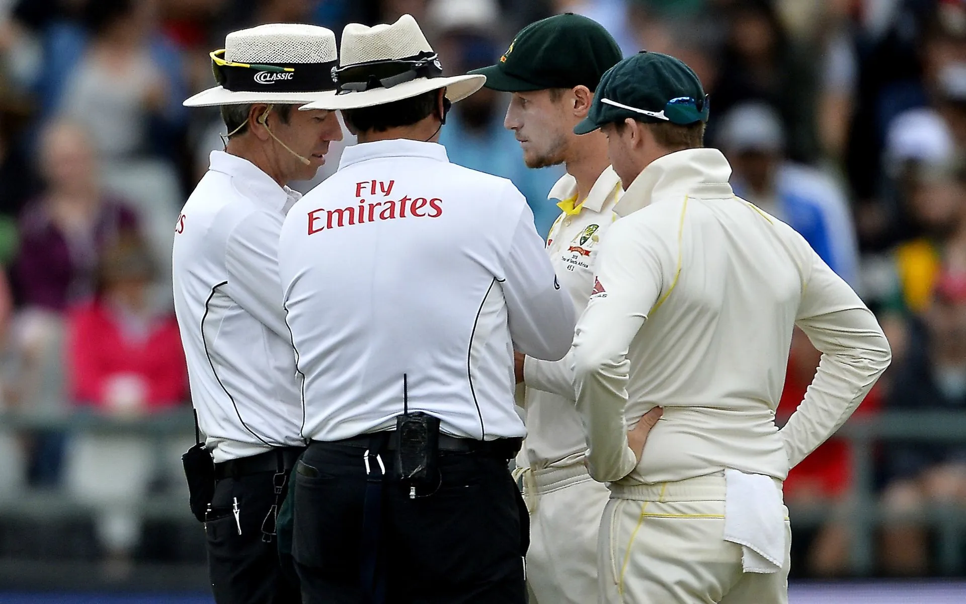 Cameron Bancroft and Steven Smith chat with umpires. [Source: @cricbuzz/X]