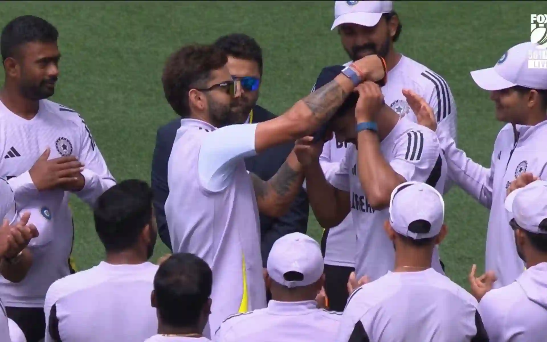 Kohli giving debut cap to Nitish Reddy [Source: @NitishKReddy/X.om]
