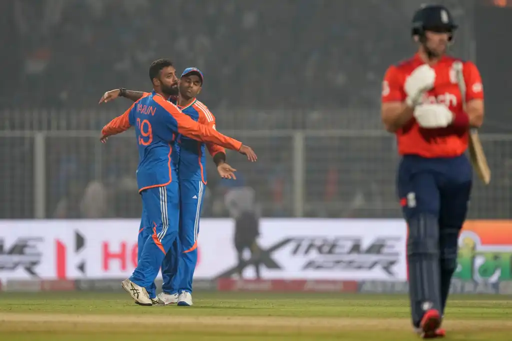 In Frame: Suryakumar Yadav and Varun Chakravarthy after the dismissal of Liam Livingstone (Source: AP Photos)