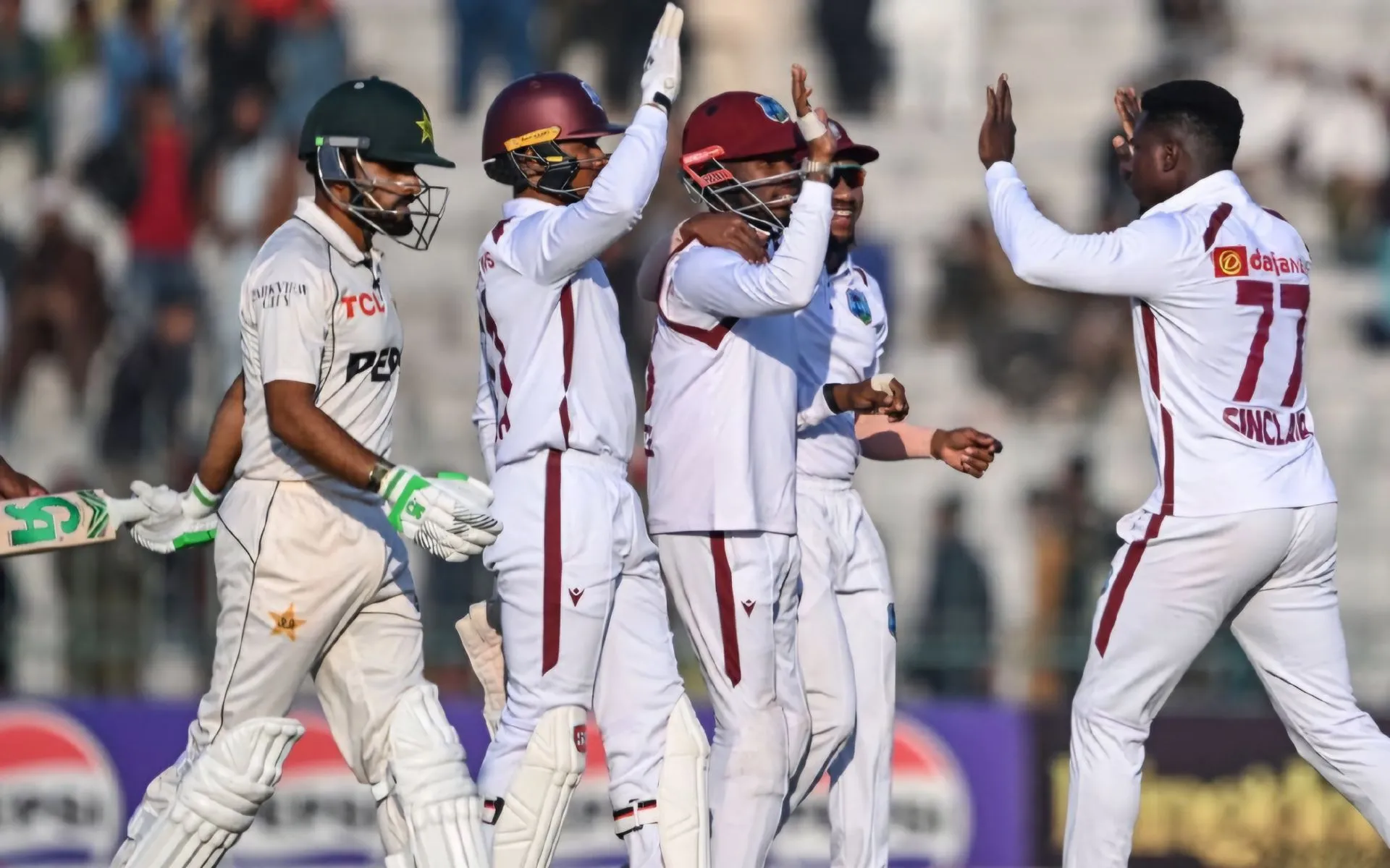 West Indian players celebrate Babar Azam's dismissal. [Source: @wiplayers/X]