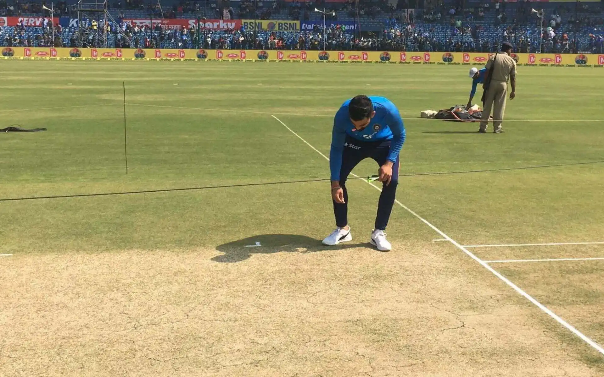 Virat Kohli inspecting the Barabati Pitch [Source: @ViratGang/x.com]