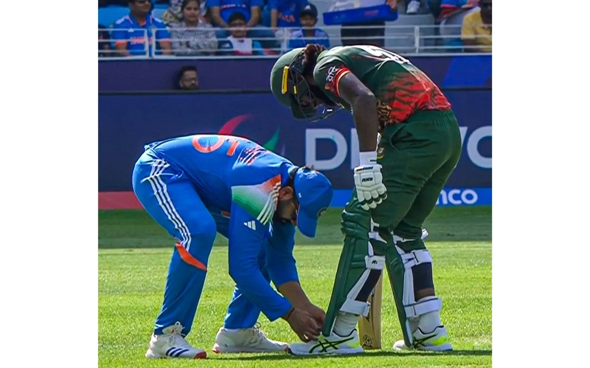 Rohit Sharma ties the shoe lace of Jaker Ali [Source: @Over_and_out1/x.com]