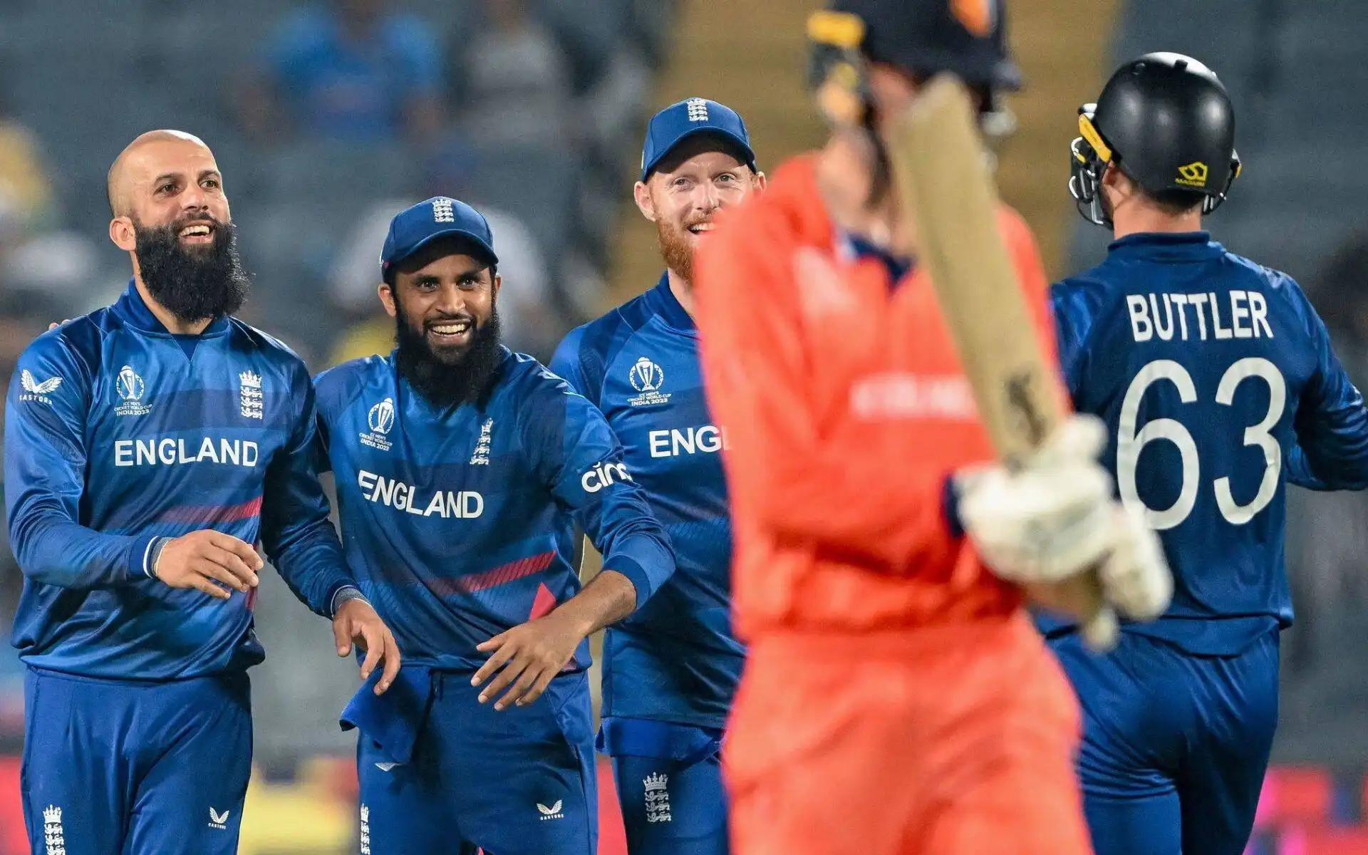 English players celebrate a wicket. [Source: @ixxcric/X]