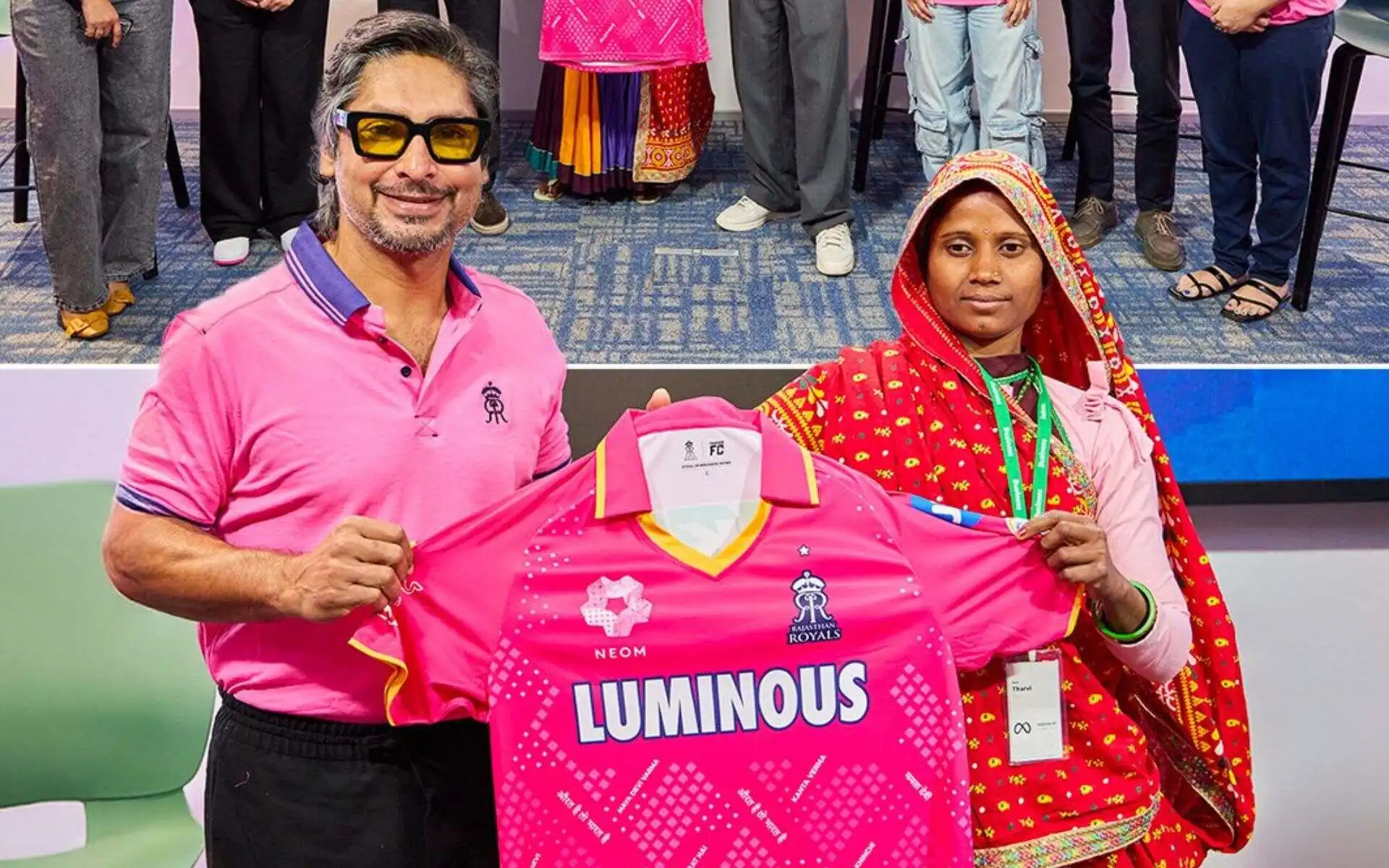 Kumar Sangakkara presents the Pink Promise Jersey to Thavri Devi. [Source: @rajasthanroyals/X]
