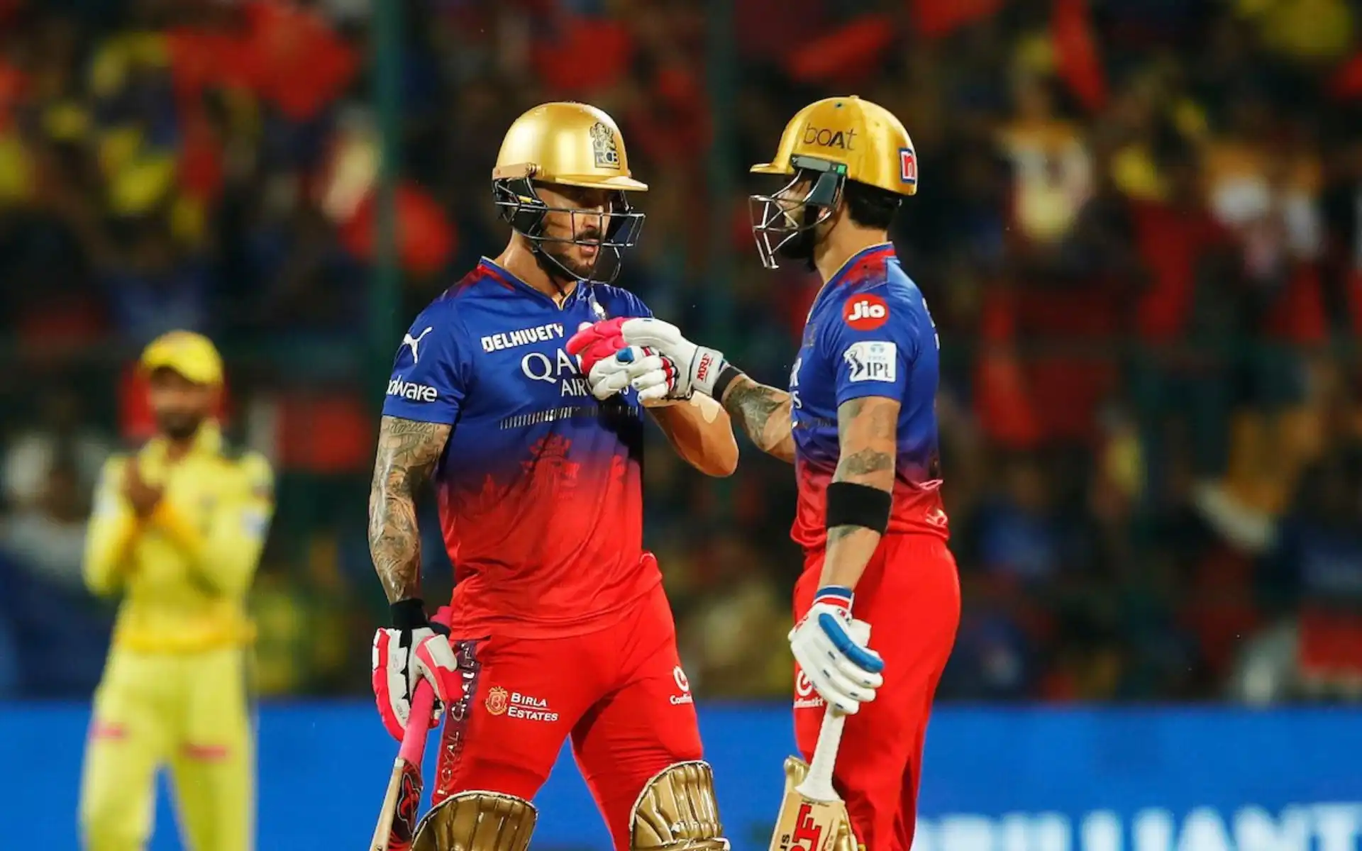 Faf du Plessis and Virat Kohli bump fists. [Source: @CineWorldCW/X]