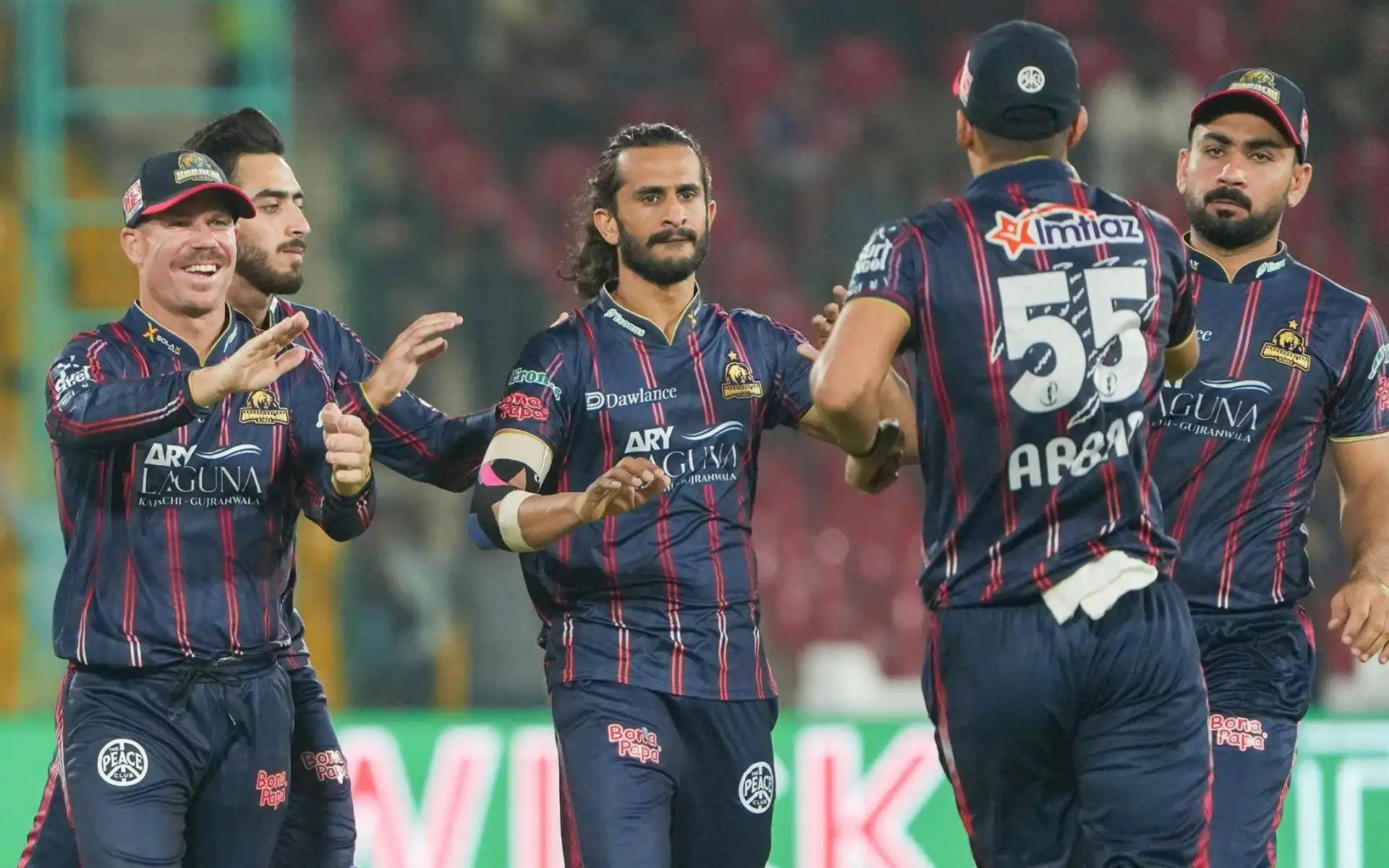 Hasan Ali celebrating a wicket with Karachi Kings teammates [Source: @thePSLt20/x]