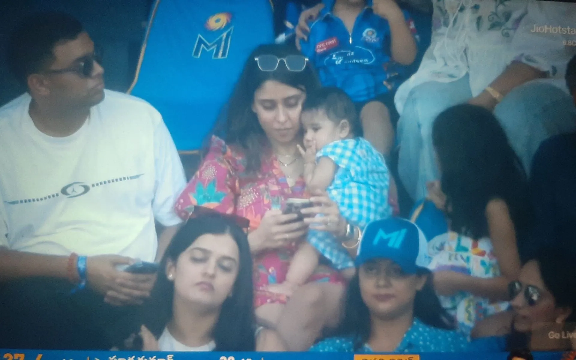 Ritika and Baby Ahaan from the stands [Source: @lucky_dhfm7/x.com]
