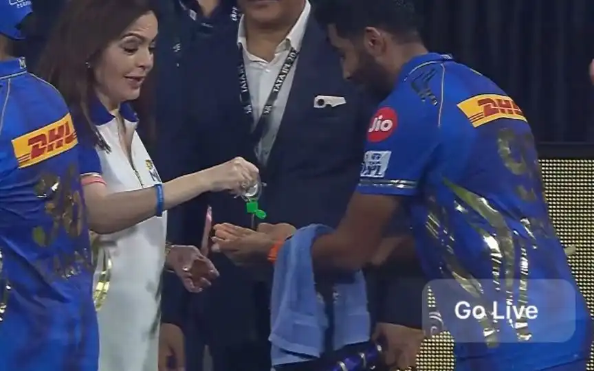 Nita Ambani Pouring Sanitizer On Bumrah's Hand (Source: @MidnightMusinng/x.com )