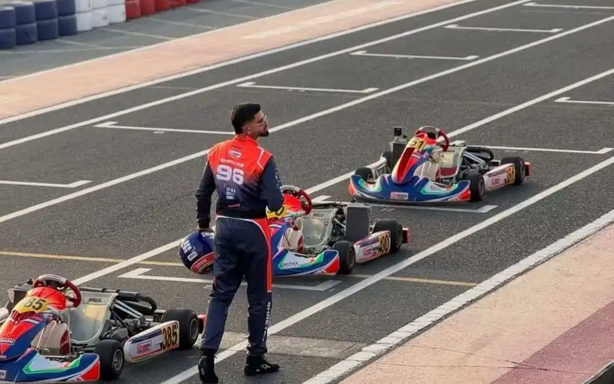 Shreyas Iyer In Racing Suit (Source: @ImTanujSingh/x.com)