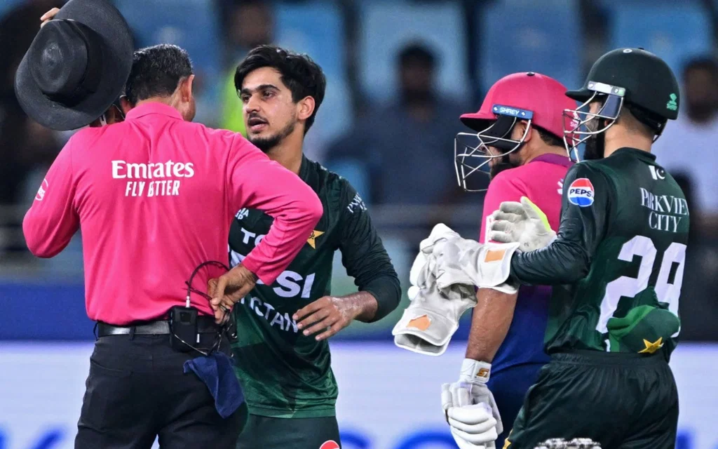 Saim Ayub checking the umpire (Source: AFP)