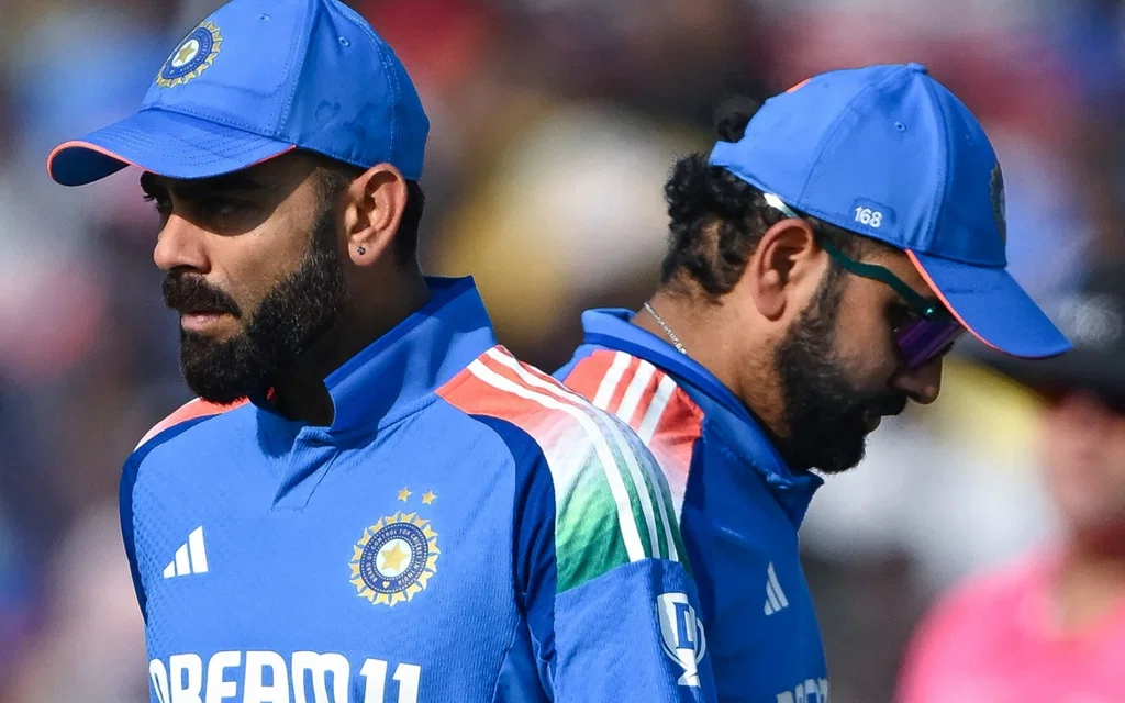 Rohit, Kohli advised by Aaron [Source: AFP Photo]
