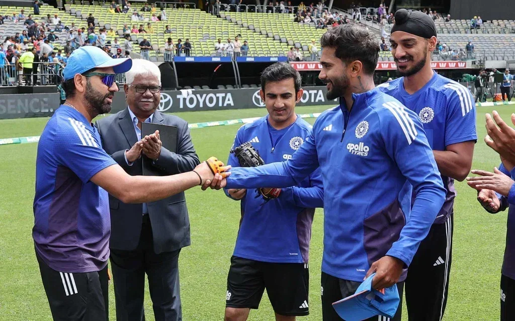 Rohit Sharma handing Nitish Reddy maiden ODI cap [Source: @BCCI/X.com]