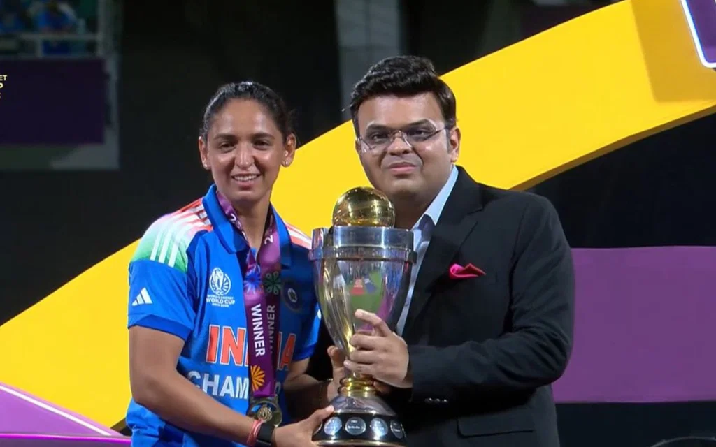 Harmanpreet Kaur collecting World Cup trophy. [Source - @WealthArigato/x.com]