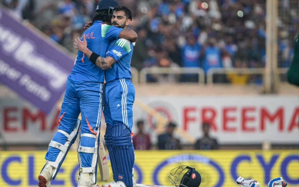 Kohli celebrates his century with KL Rahul [Source: AFP Photo]