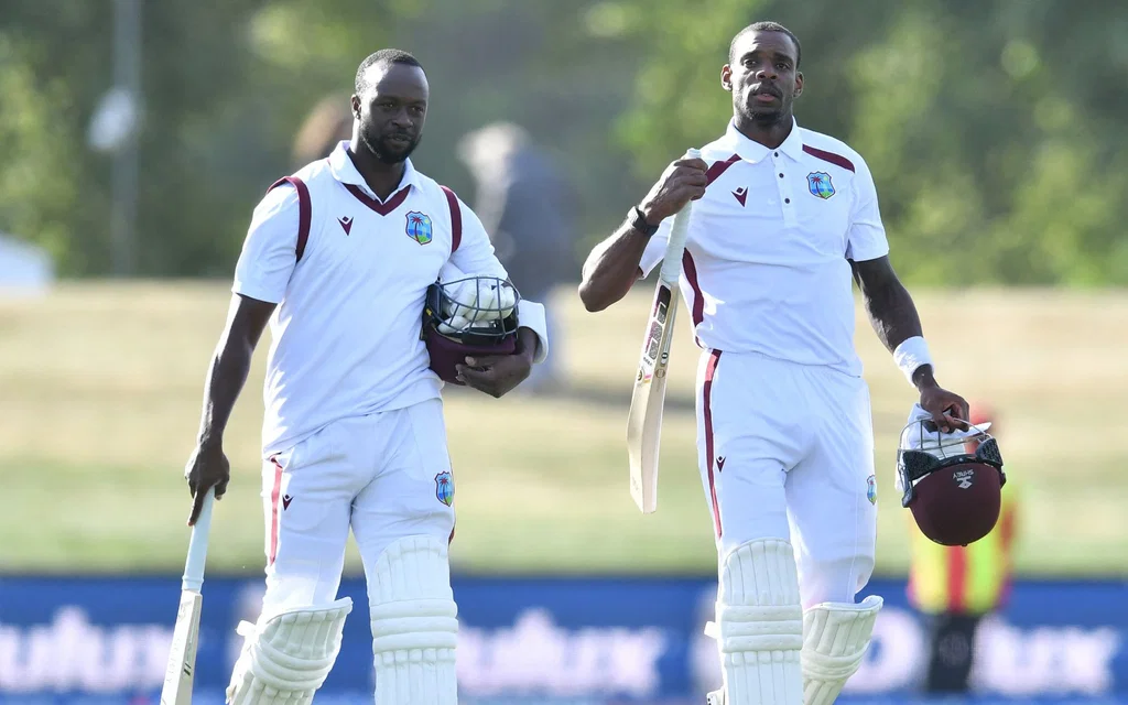 Kemar Roach and Justin Greaves (Source: AFP) 