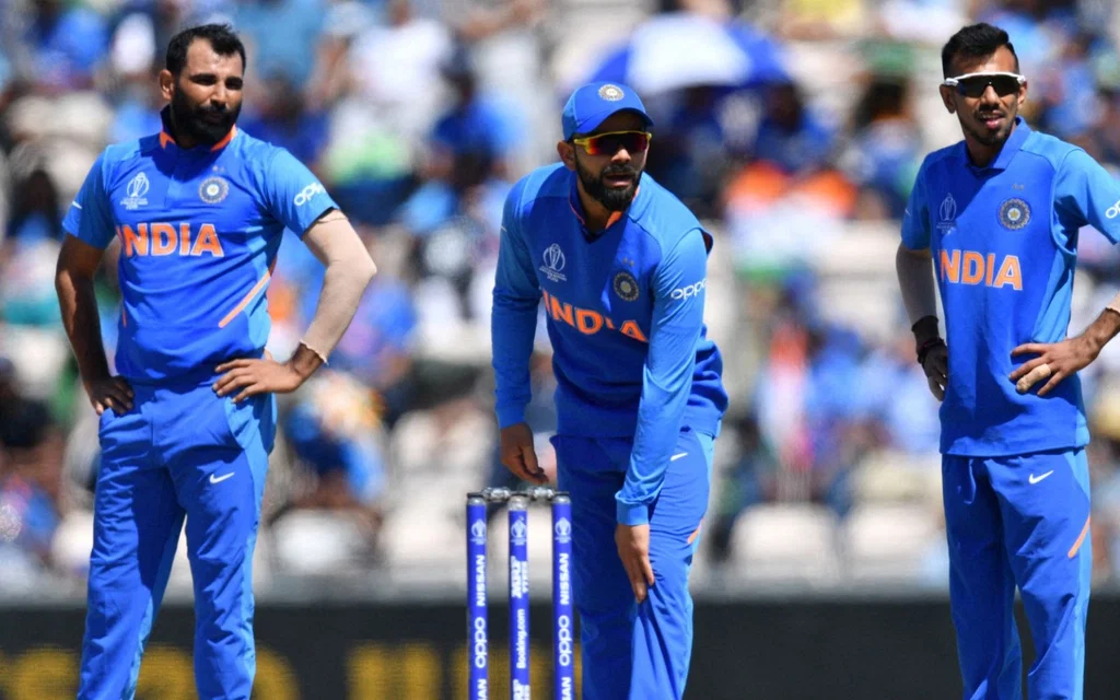Chahal and Shami with India team - (Source: @AFP)