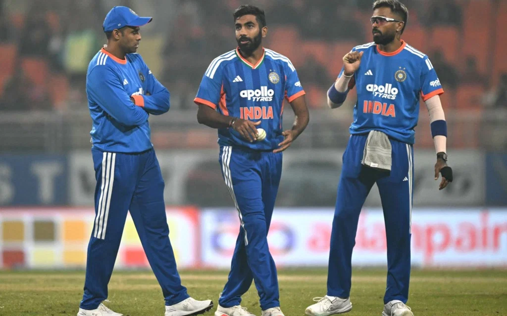 Jasprit Bumrah (C) with Suryakumar Yadav (L), and Hardik Pandya (R)