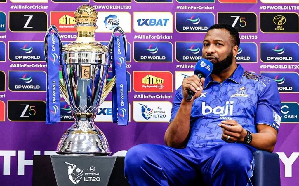Kieron Pollard beside ILT20 trophy [Source: @ILT20Official/X]