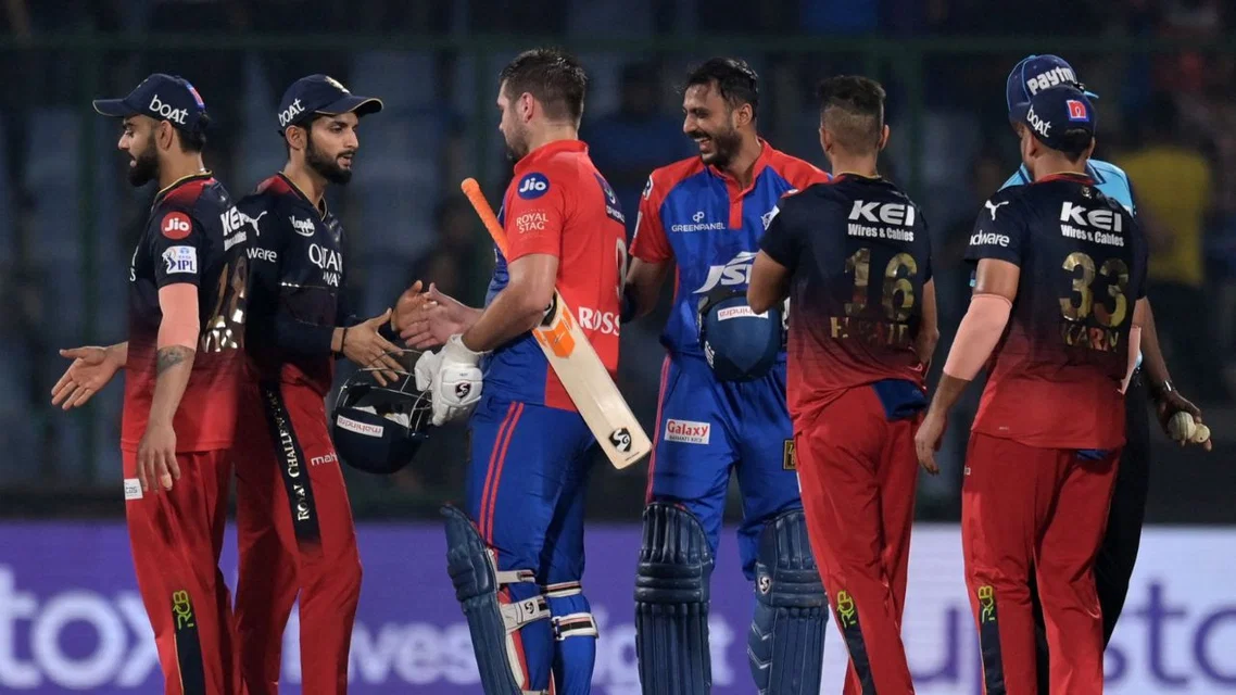 Rilee Rossouw & Axar Patel with RCB players in IPL 2023. Credits - AFP