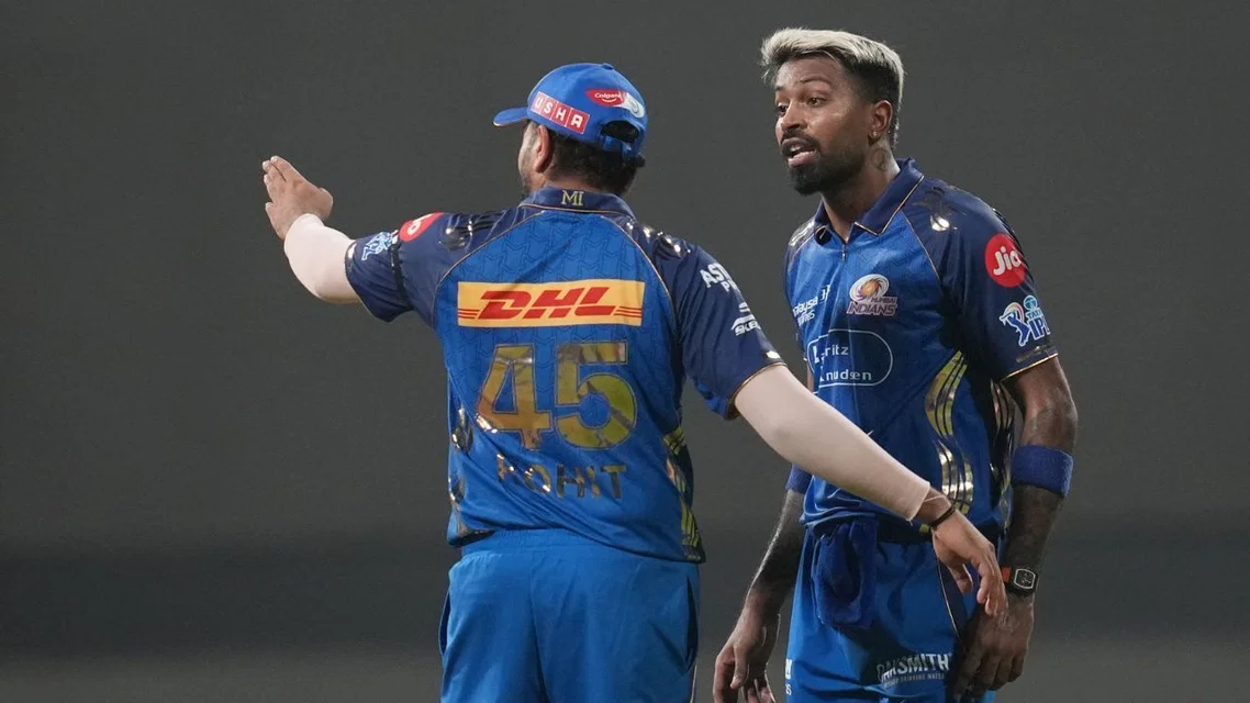 Rohit Sharma and Hardik Pandya chatting in IPL 2026. Credit - AP