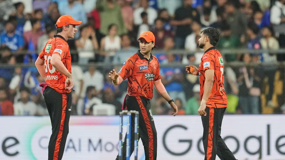 Pat Cummins with Abhishek Sharma & Harsh Dubey. Credits- AFP