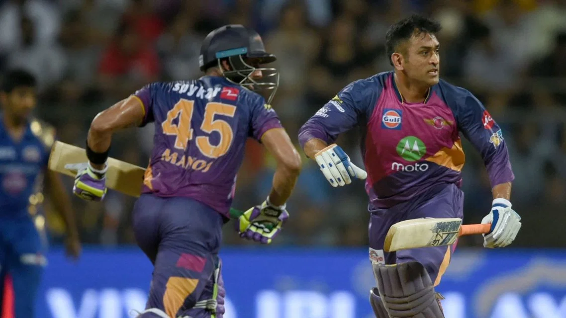 Manoj Tiwary and MS Dhoni [Source: AFP]